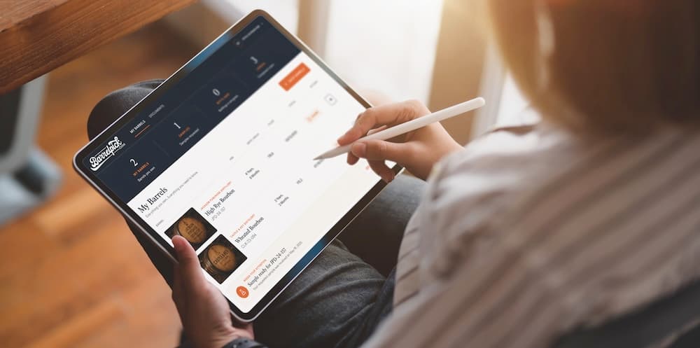 A barrel owner checking their barrels in the owner portal on a tablet